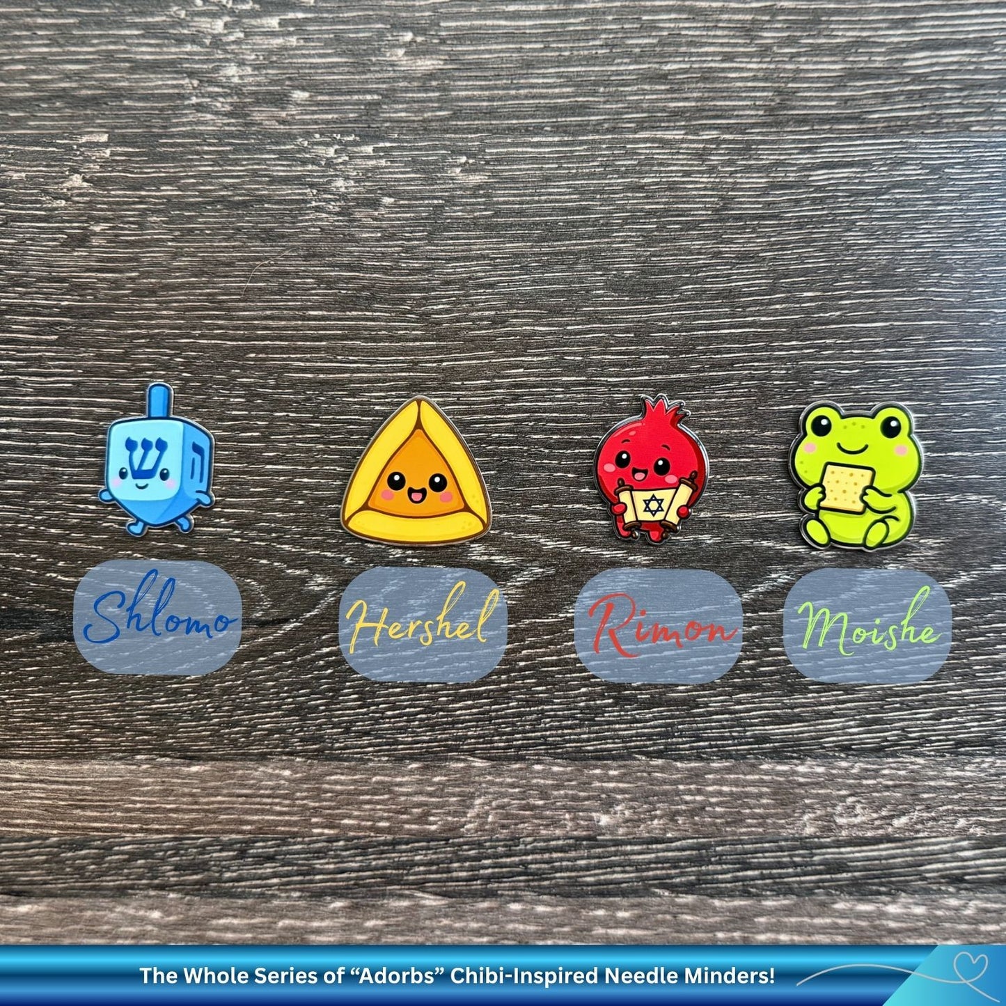 Set of colorful, cute Chibi-inspired needle minders with names on a wooden surface.