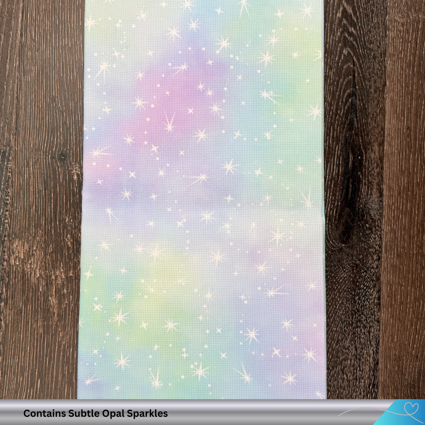 Pastel rainbow pattern for cross-stitch embroiderers with starbursts on a wooden background