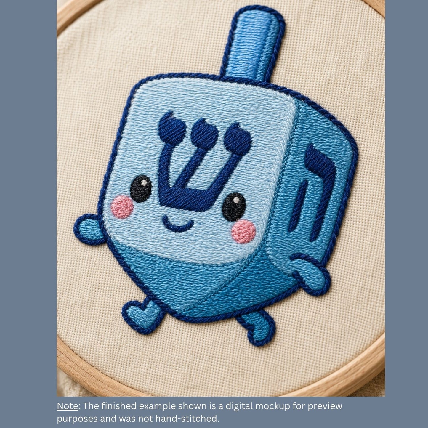 Embroidery of a blue dreidel with a happy face on a beige fabric background.