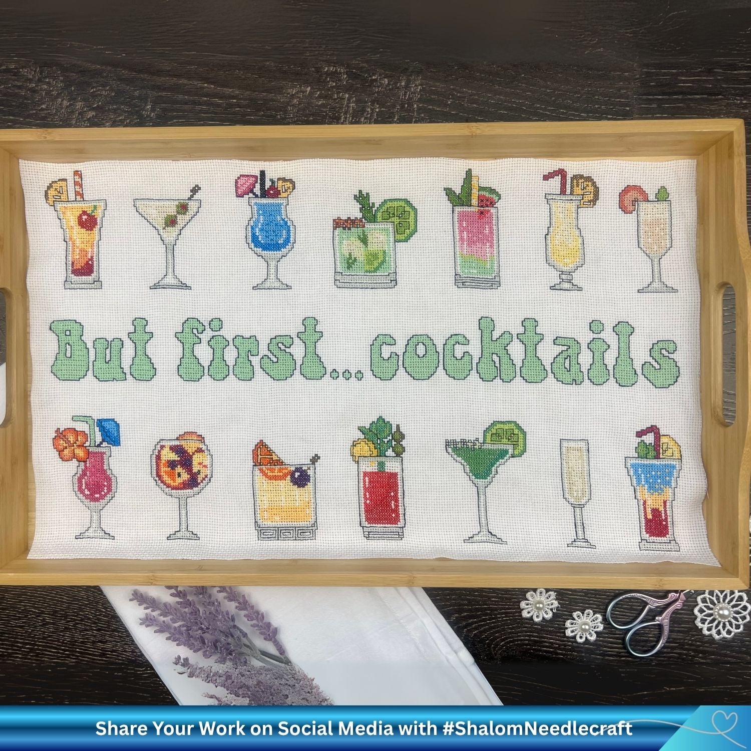 Wooden tray with a cross stitch pattern featuring cocktail glasses and text 'But first... cocktails'.