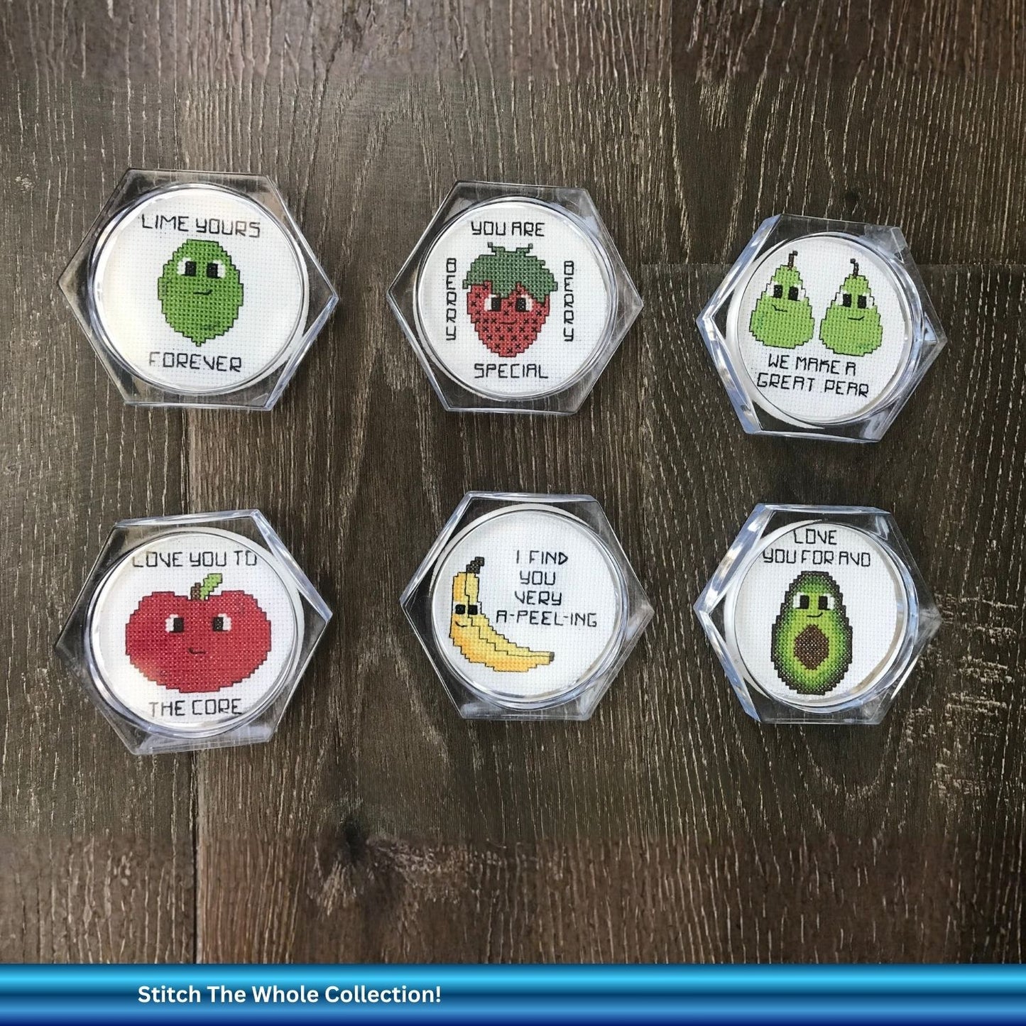 Hexagonal embroidered coasters with fruit designs and funny puns on a wooden surface.