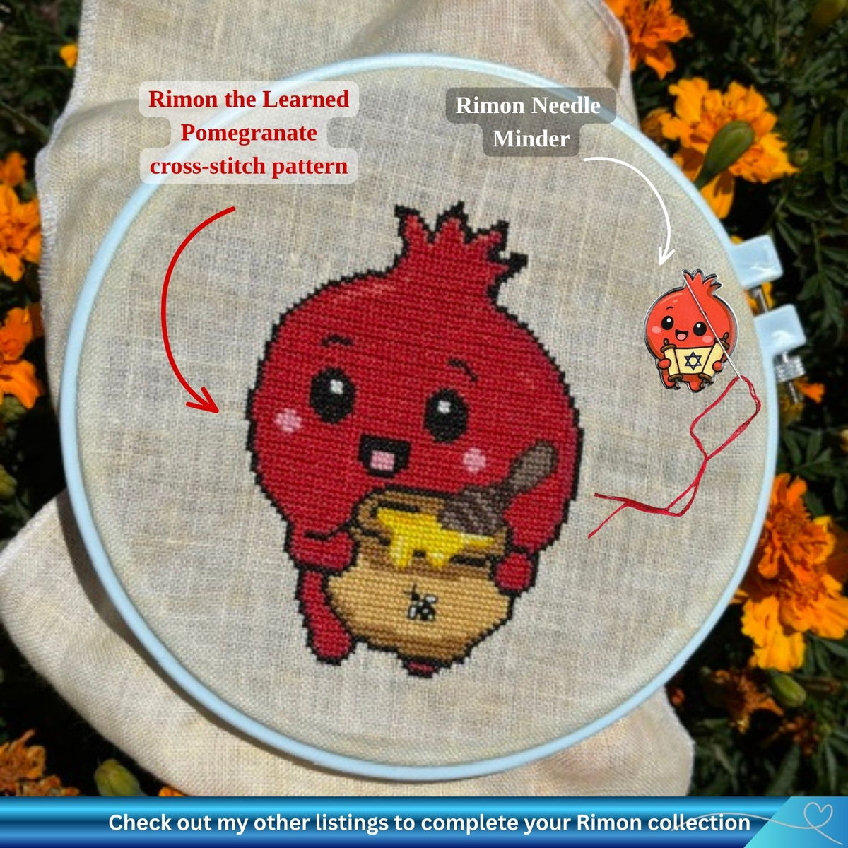 A cross-stitch embroidery hoop holding a finished stitched design of a red pomegranate character (Rimon) holding a honey jar, shown outdoors among orange flowers. Text labels point to the design as 'Rimon the Learned Pomegranate cross-stitch pattern' and to a small matching charm as 'Rimon Needle Minder.