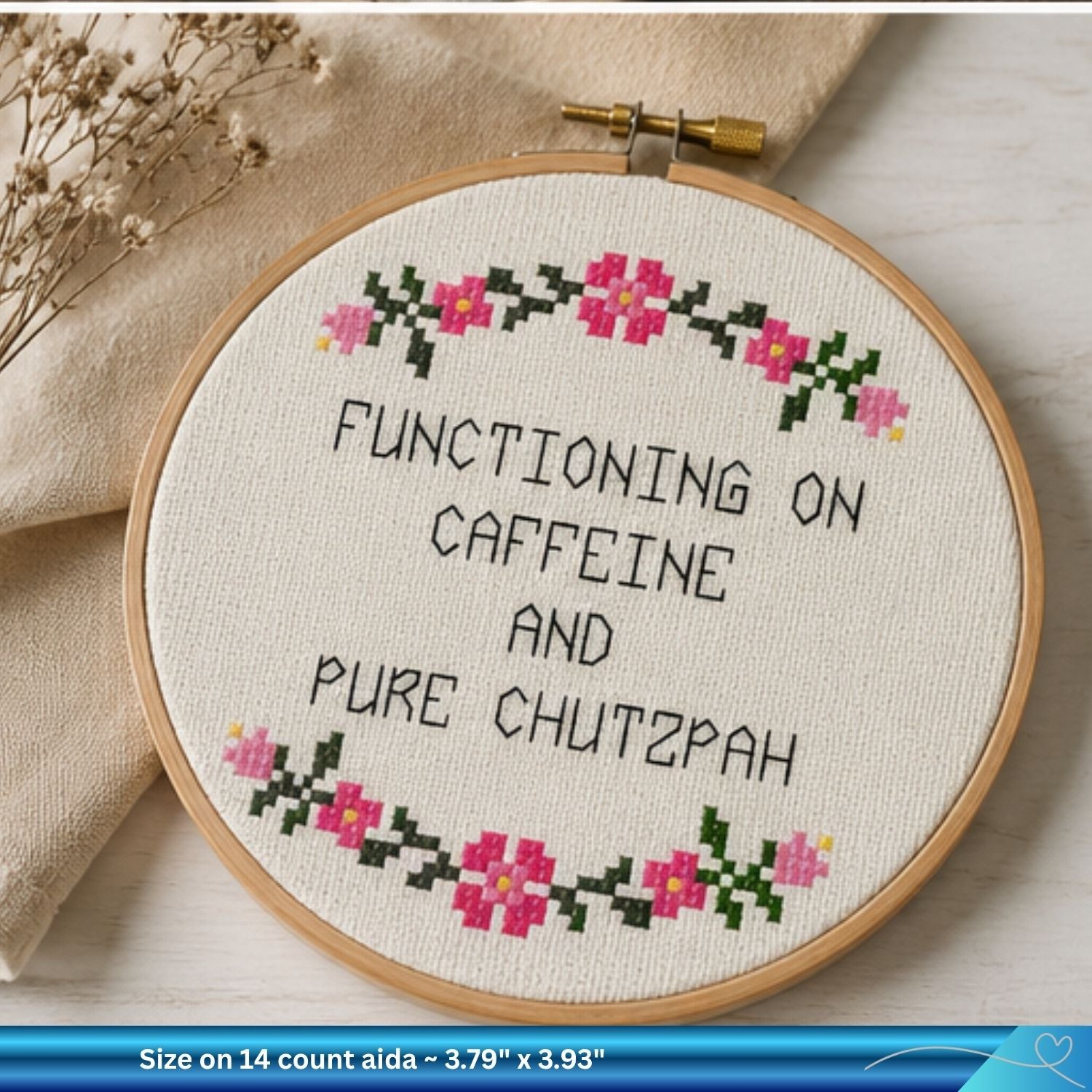 Finished Judaica hand embroidered saying framed by a hoop against a neutral background