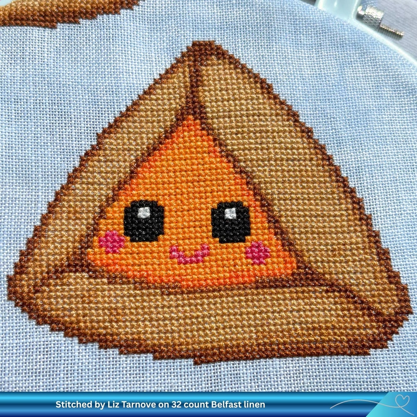 Cross-stitched design of a cute apricot Hamantaschen character on linen fabric.