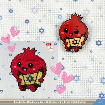 Red pomegranate character cross-stitch pattern and matching needle minder on a Star of David fabric background.