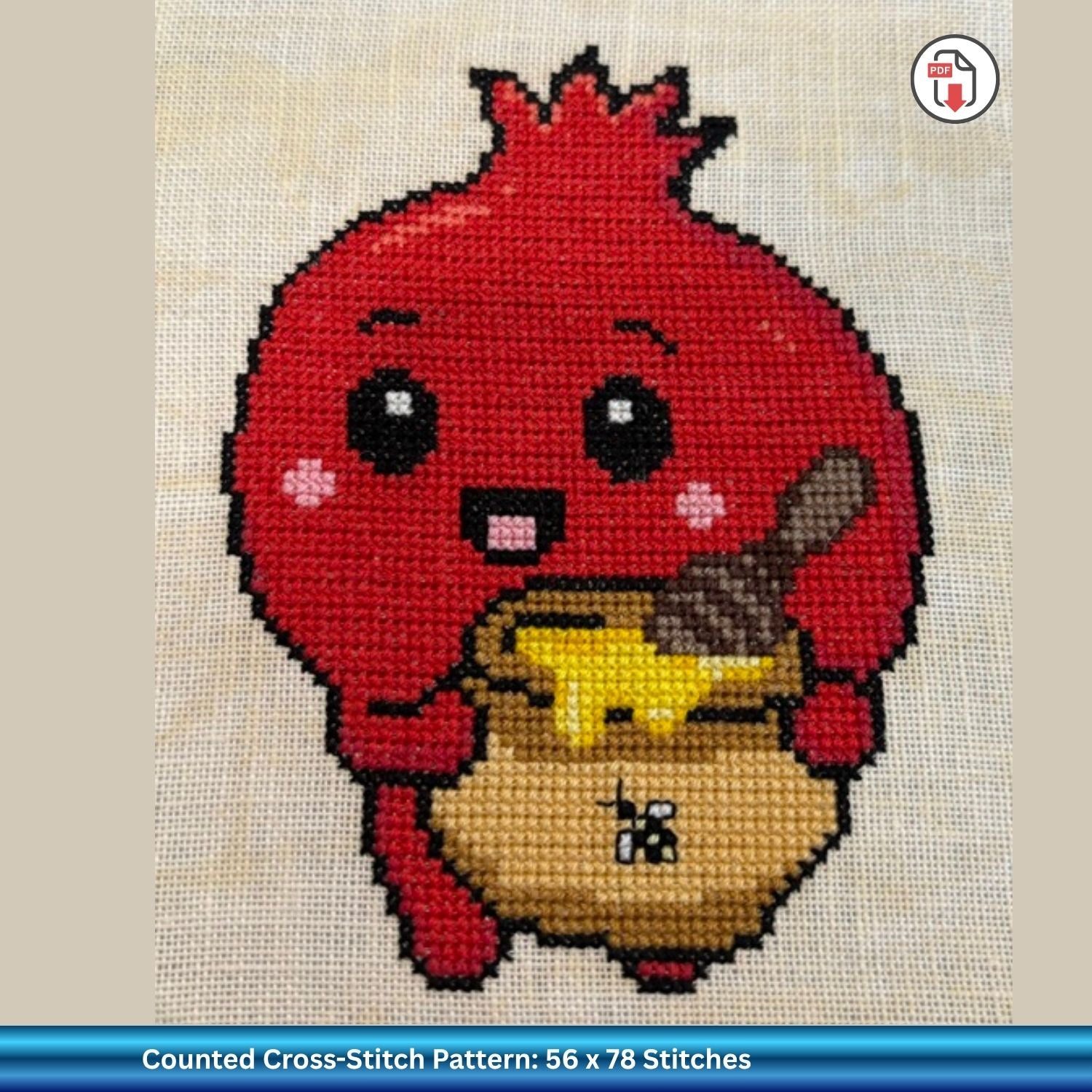 A counted cross-stitch pattern design to celebrate Rosh Hashanah of a cute red pomegranate character holding a pot of honey, shown on a textured white fabric background with a blue text banner at the bottom indicating 'Counted Cross-Stitch Pattern: 56 x 78 Stitches'.