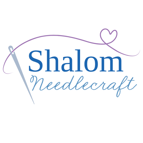Logo for Shalom Needlecraft with a needle and heart design on a white background